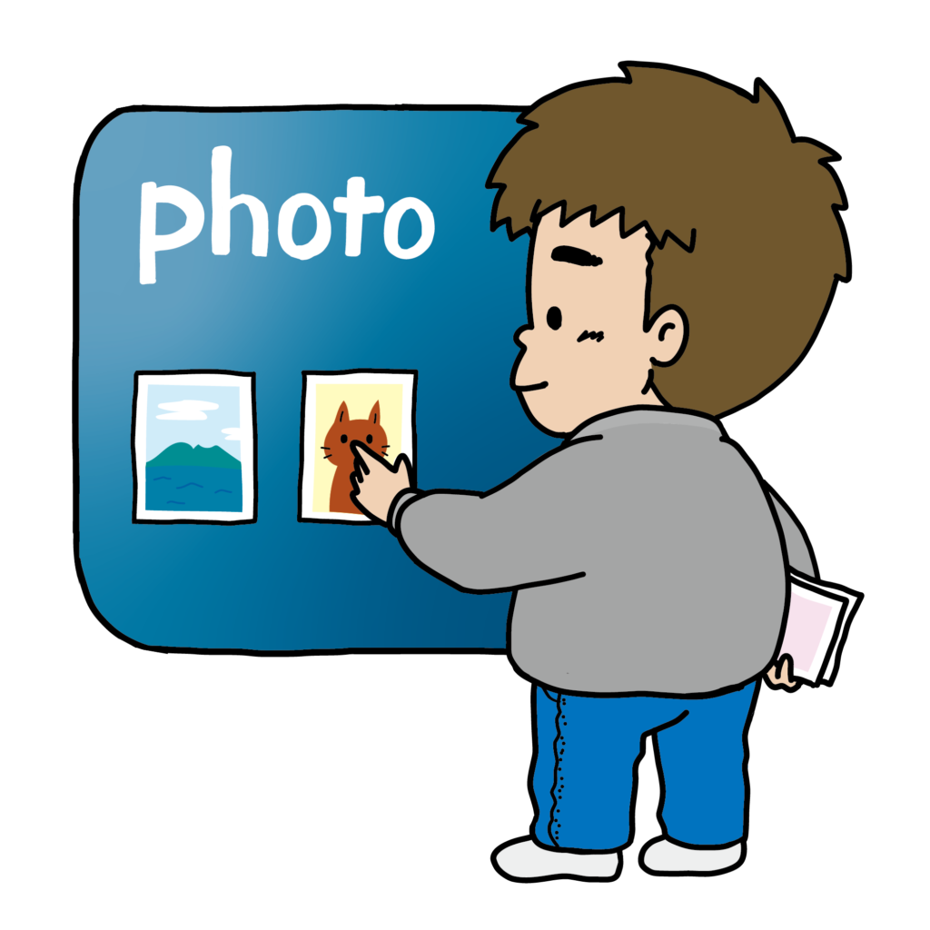 パソコンで写真データを整理している男の子のイラスト